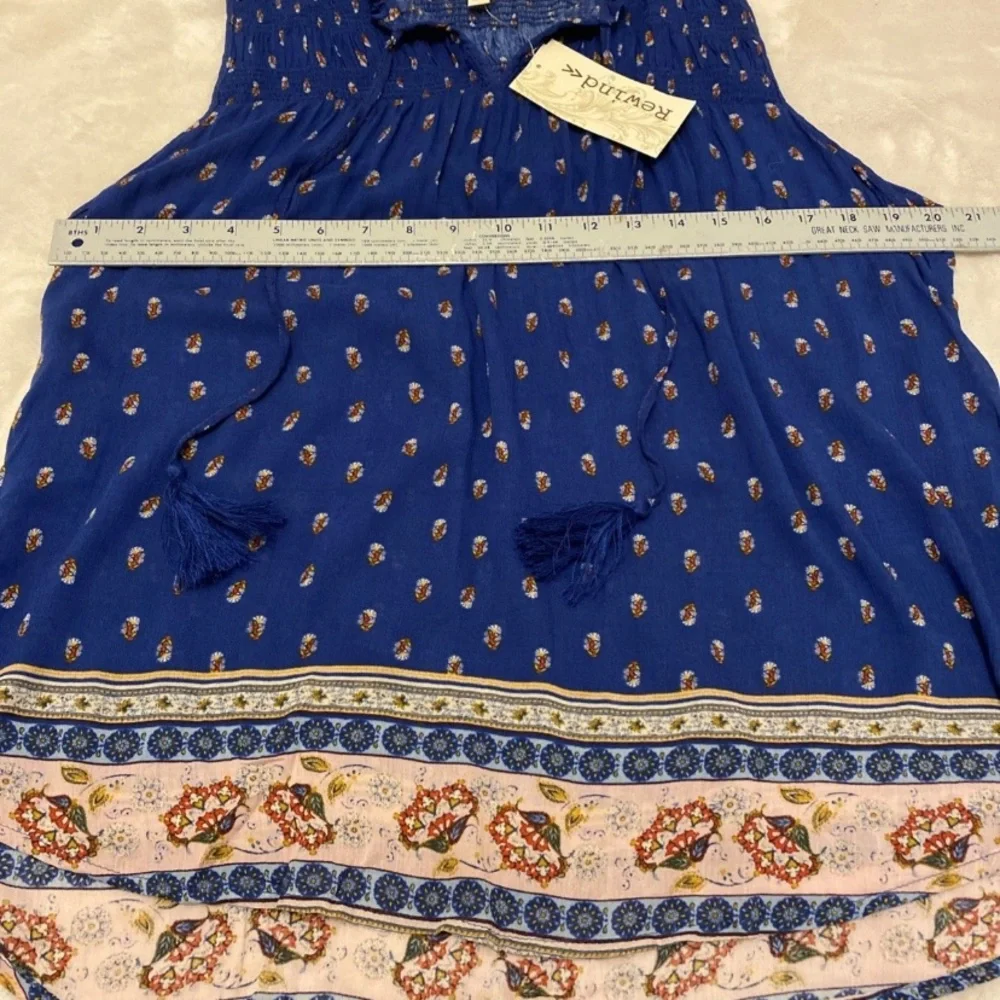 Rewind Royal Blue Sleeveless Floral Blouse with Patterned Hem